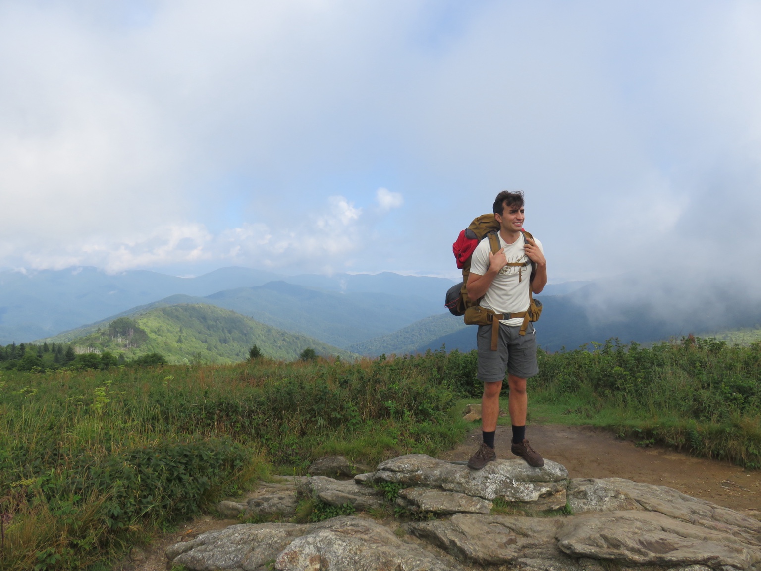 Roman standing with a backpack at Black Balsam Knob in western North Carolina.